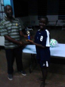 Captain of Carl Brown accepting the winning trophy